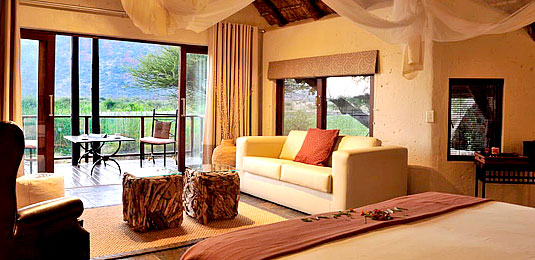 Chalet Bedroom & Lounge - Tau Game Lodge - Madikwe Game Reserve